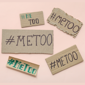 Multiple cardboard pieces with "#MeToo" written on them