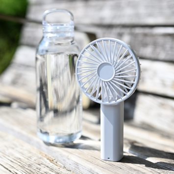 An example of heat preparedness with a bottle of water and a handheld fan