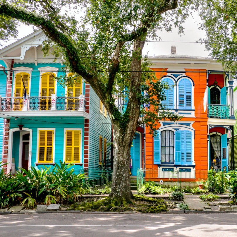Two colorful houses representing New Orleans architecture
