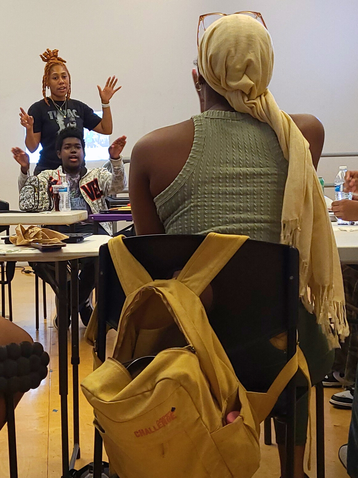 Participants in Enrichment 2 Empowerment listen to instructions for their next activity.