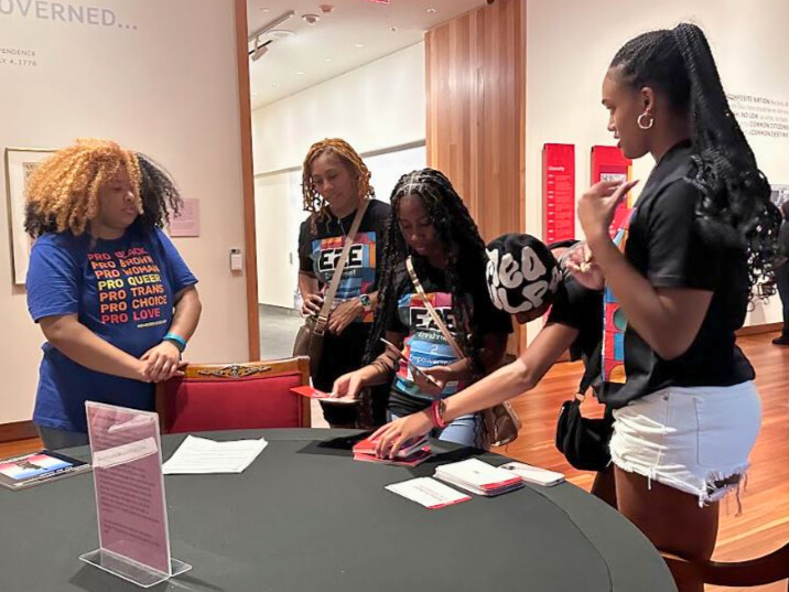 Participants in Youth Pride Fest tie dye socks.