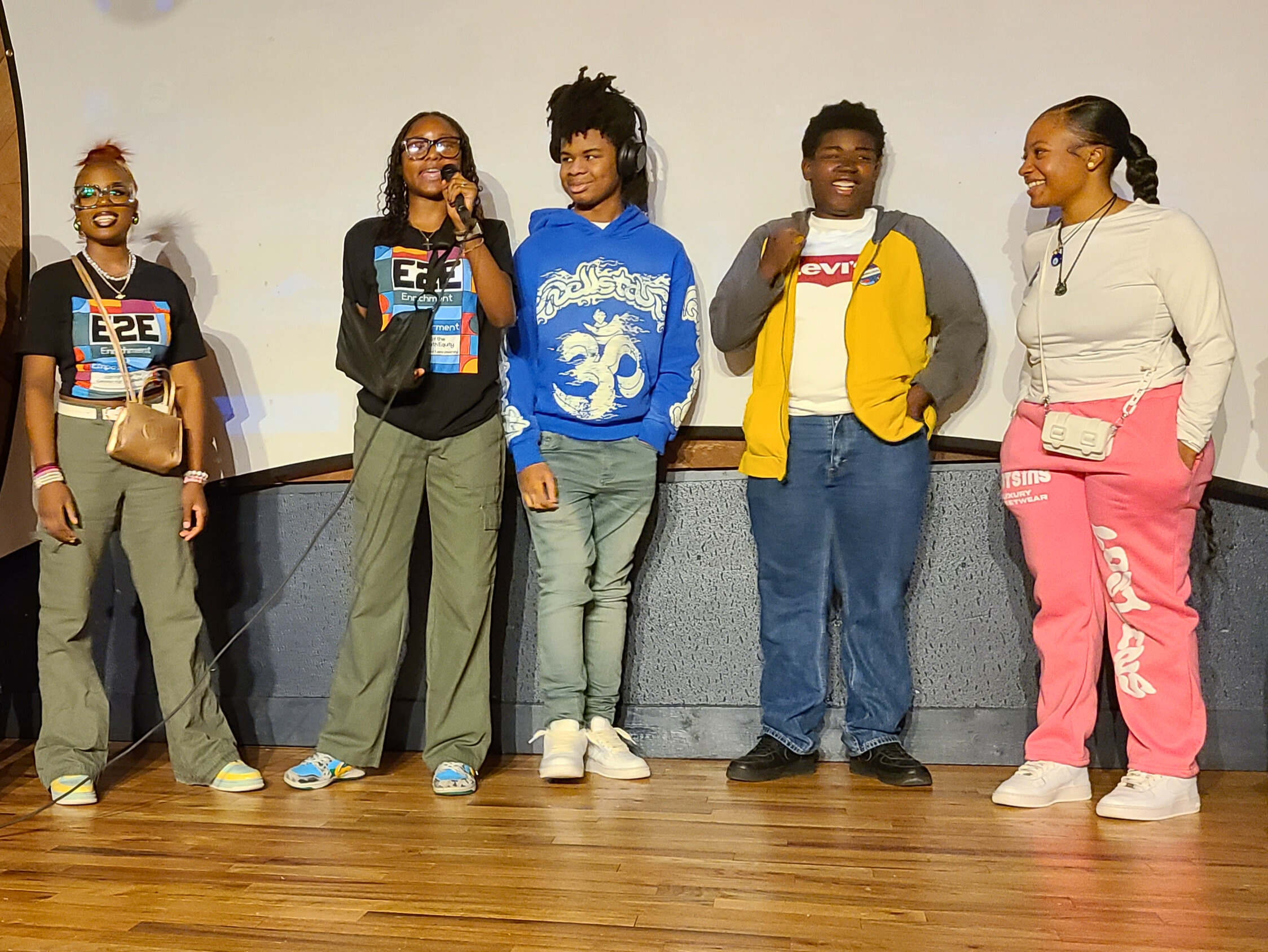 E2E participants give a presentation after one of their documentary screenings.