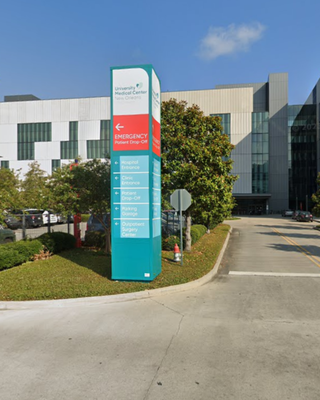 E2E Participants sit on steps in the Broadmoor Arts & Wellness Center.