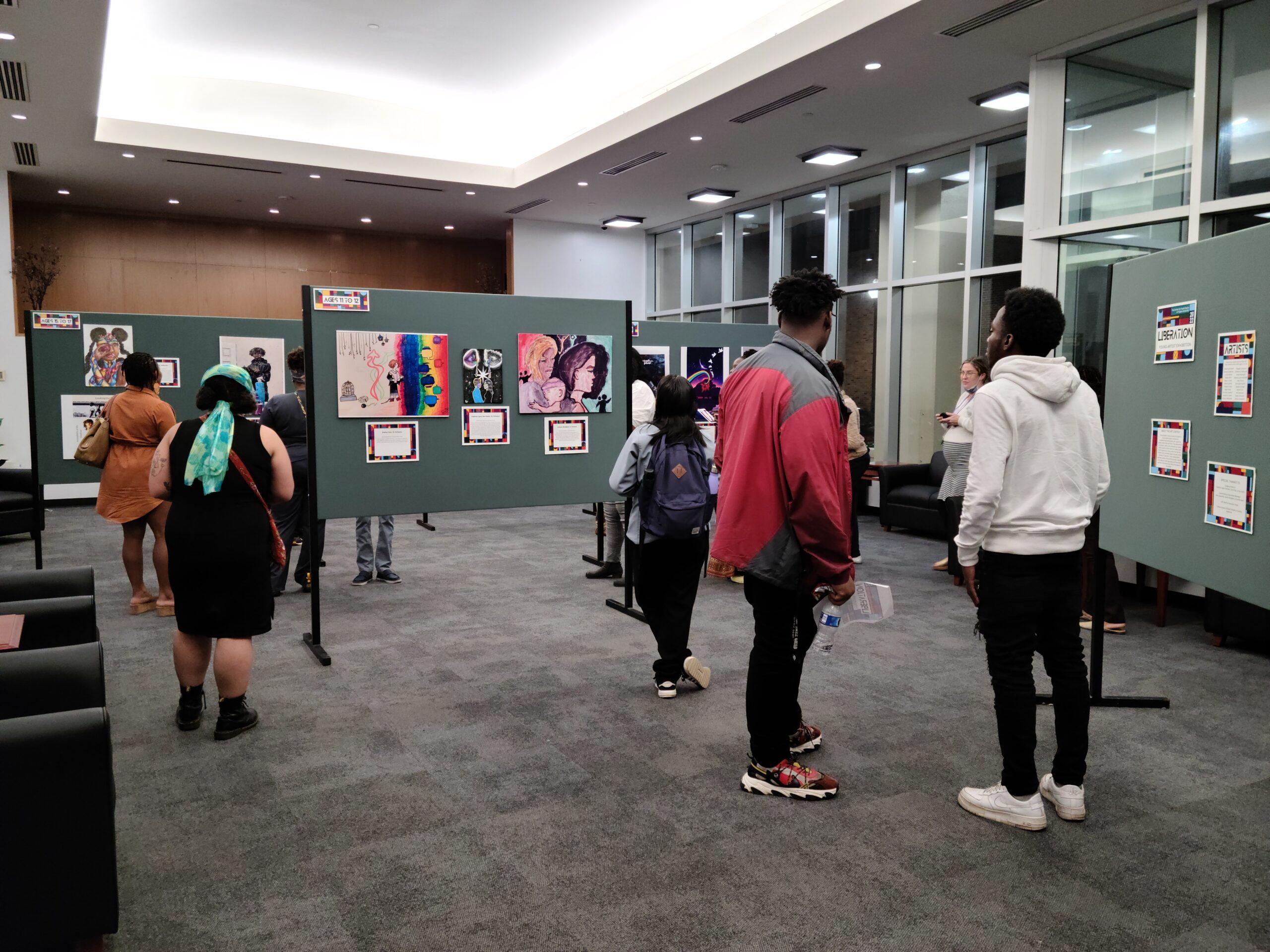 Visitors to the 2022 Youth Art Contest view the exhibit.