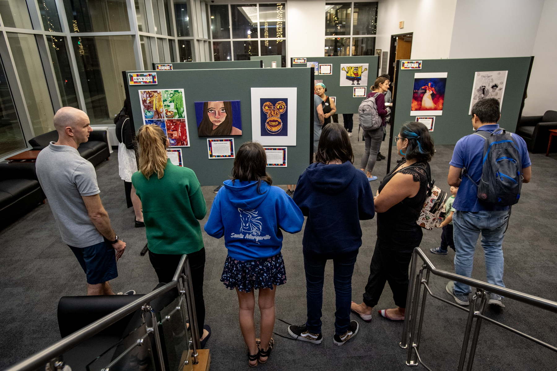 Visitors to the 2022 Youth Art Contest view the exhibit.